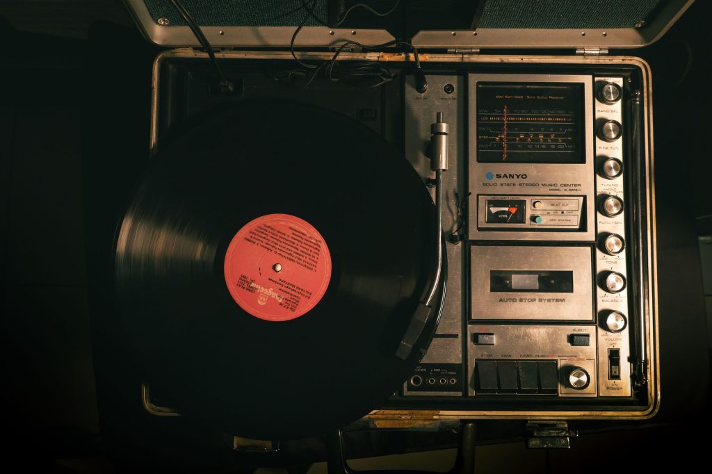 A nostalgic vinyl record spinning on a vintage player, evoking retro vibes.