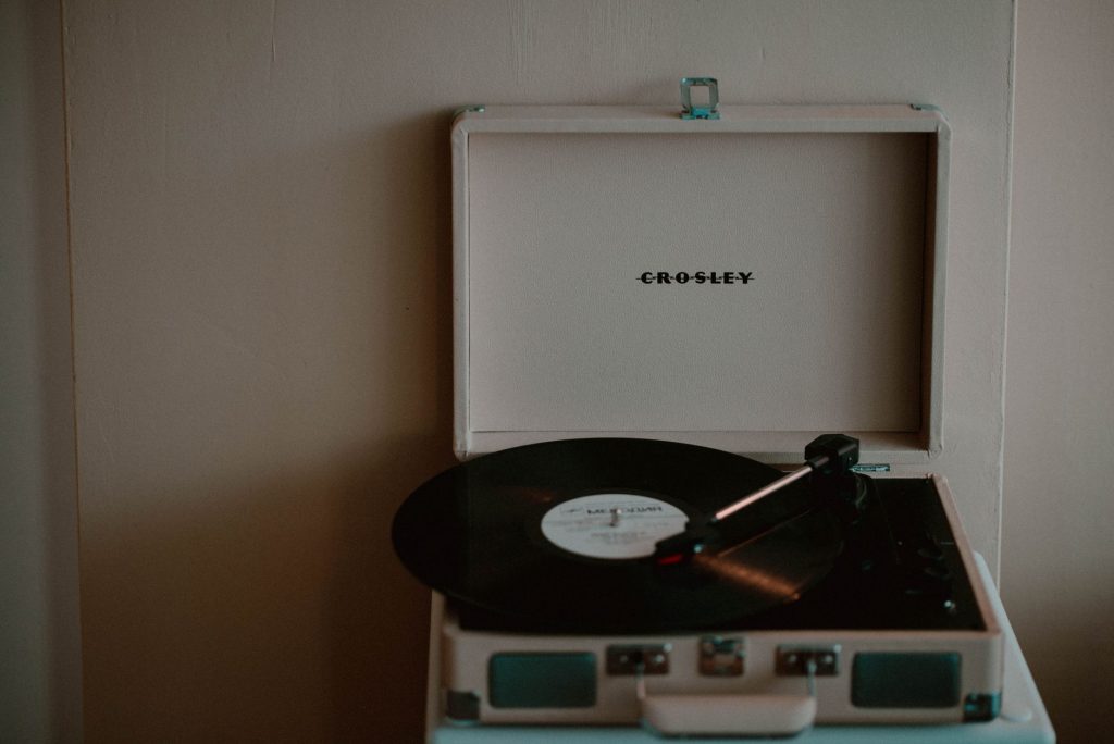 A nostalgic Crosley turntable with vinyl record creates a retro vibe.